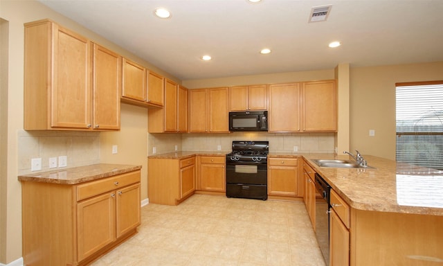 kitchen featuring sink, black appliances, and light brown cabinets