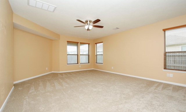 empty room with light carpet and ceiling fan