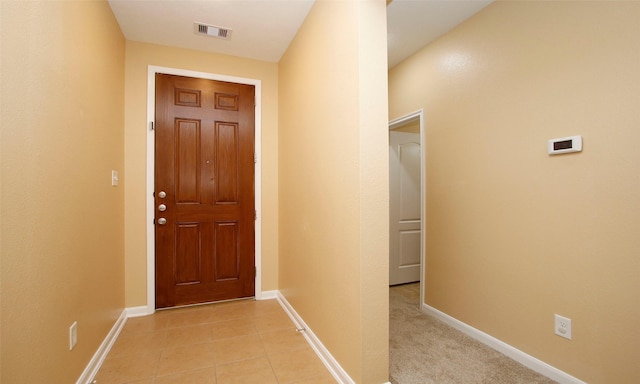 entryway featuring light tile patterned floors