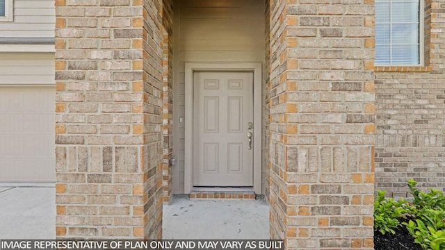 entrance to property featuring a garage