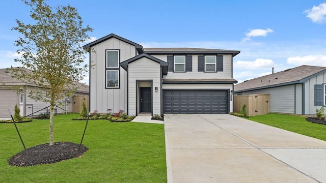 view of front facade with a front yard and a garage