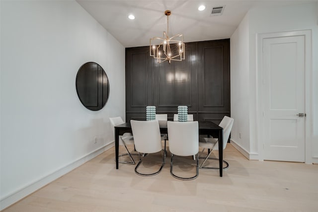 dining space with light wood finished floors, visible vents, baseboards, a chandelier, and recessed lighting