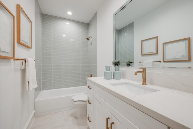 full bath with toilet, vanity, and shower / bathing tub combination