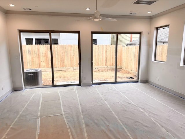 empty room with recessed lighting, visible vents, and baseboards