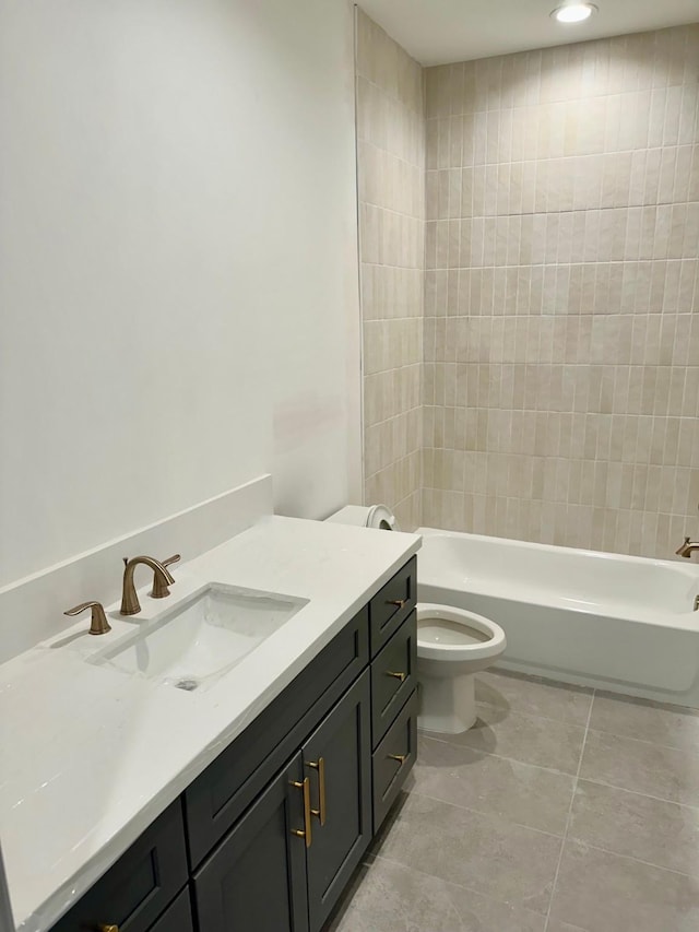 full bath featuring tile patterned floors, toilet, shower / washtub combination, and vanity