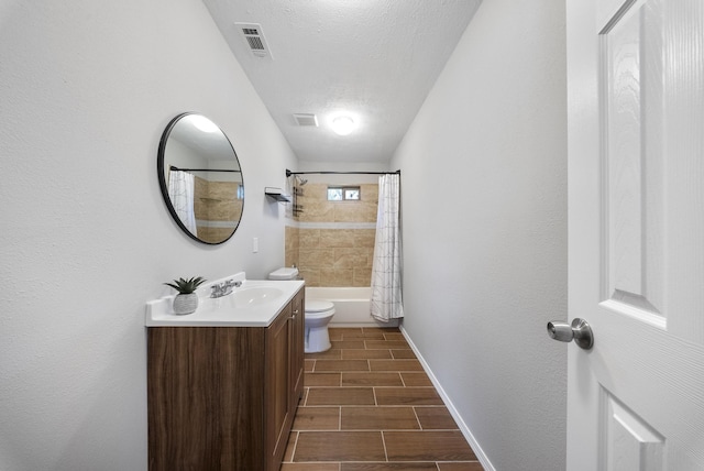 full bathroom with shower / bath combination with curtain, toilet, a textured ceiling, and vanity