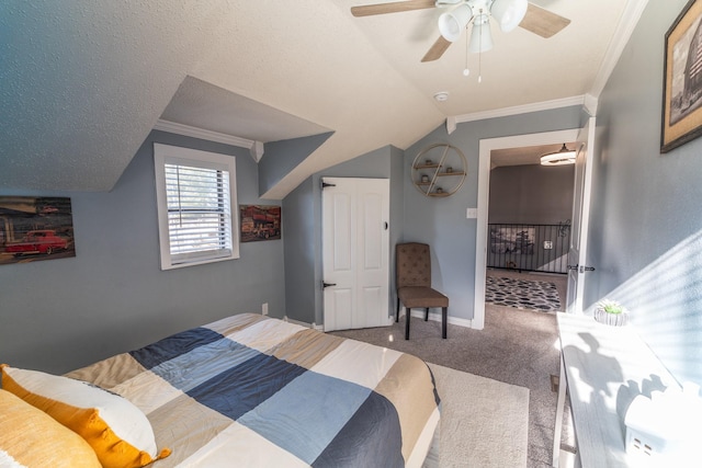 bedroom with baseboards, ceiling fan, ornamental molding, vaulted ceiling, and carpet flooring