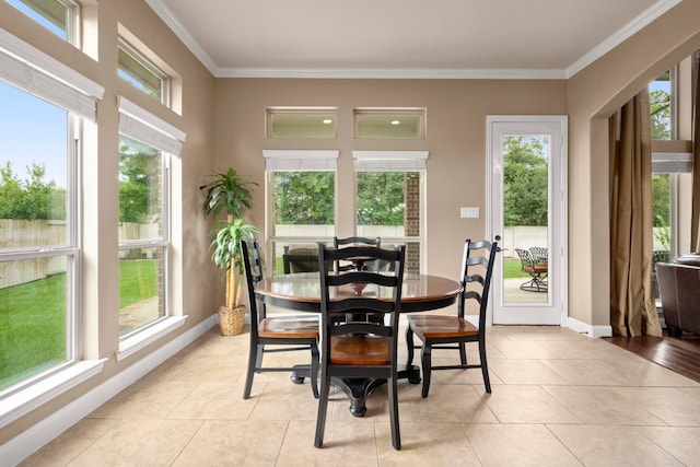 dining space featuring light tile patterned floors and ornamental molding