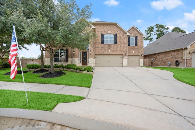 view of front of home with a garage and a front lawn