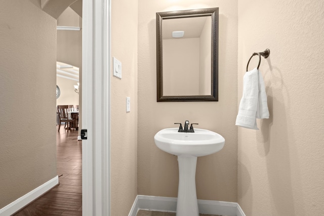 bathroom with hardwood / wood-style floors