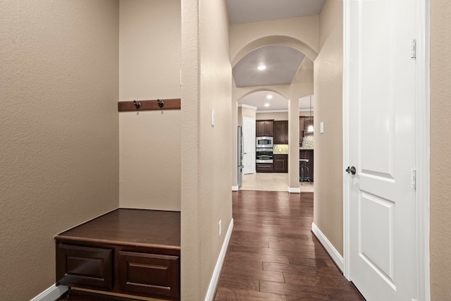 hall featuring dark wood-type flooring