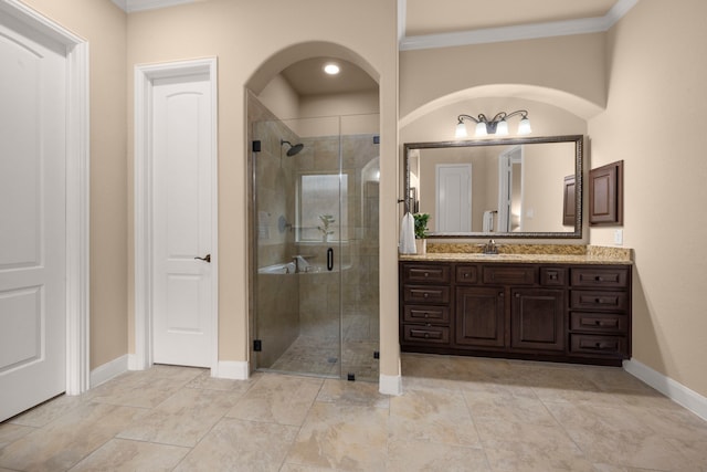 bathroom with walk in shower, vanity, and ornamental molding