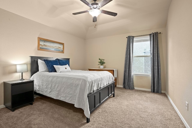 carpeted bedroom featuring ceiling fan and vaulted ceiling