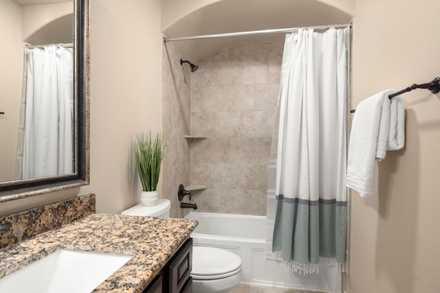 full bathroom with vanity, toilet, and shower / tub combo with curtain