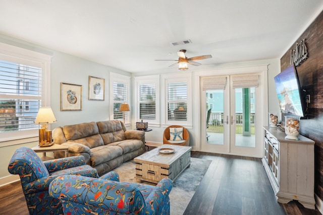 living room featuring french doors, dark hardwood / wood-style floors, and ceiling fan