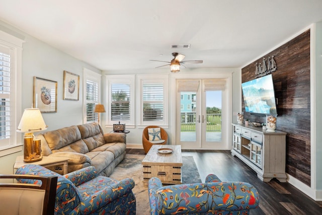 living room with french doors, dark hardwood / wood-style floors, a wealth of natural light, and ceiling fan