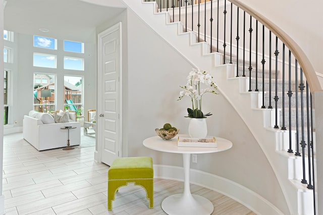 stairs with hardwood / wood-style floors