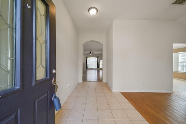 foyer featuring ceiling fan and light tile patterned flooring