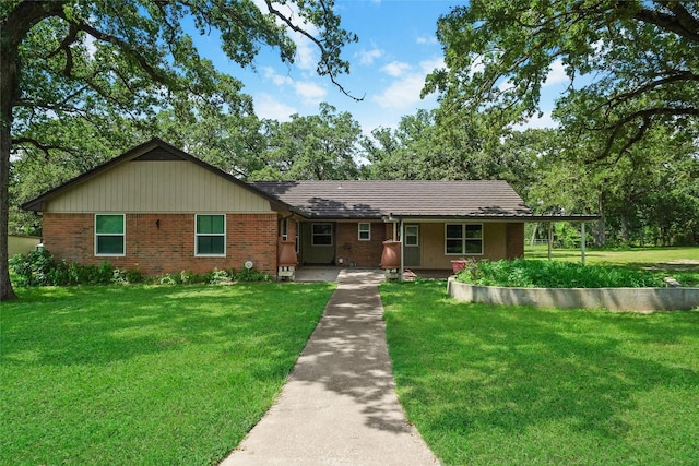 single story home featuring brick siding and a front lawn