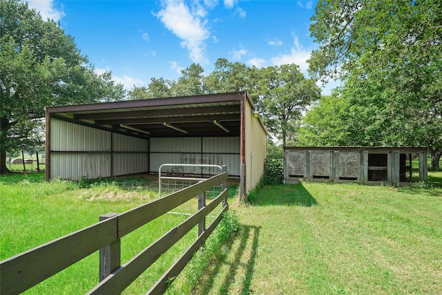 view of outdoor structure featuring a lawn