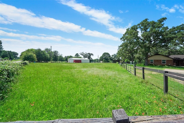 view of yard with a rural view