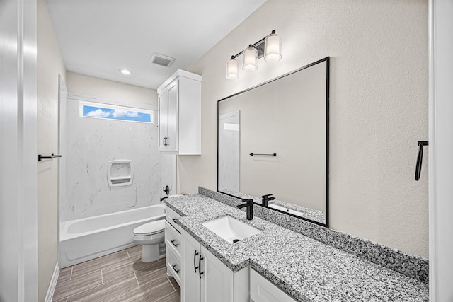 full bathroom featuring vanity, toilet, and shower / tub combination