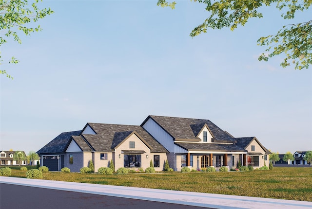 view of front of home featuring a front yard and a garage