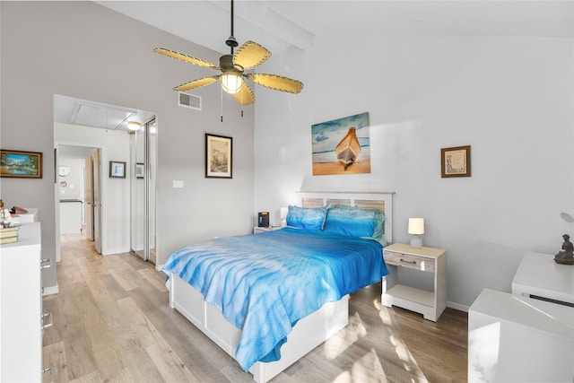 bedroom featuring ceiling fan, beamed ceiling, high vaulted ceiling, and light hardwood / wood-style floors