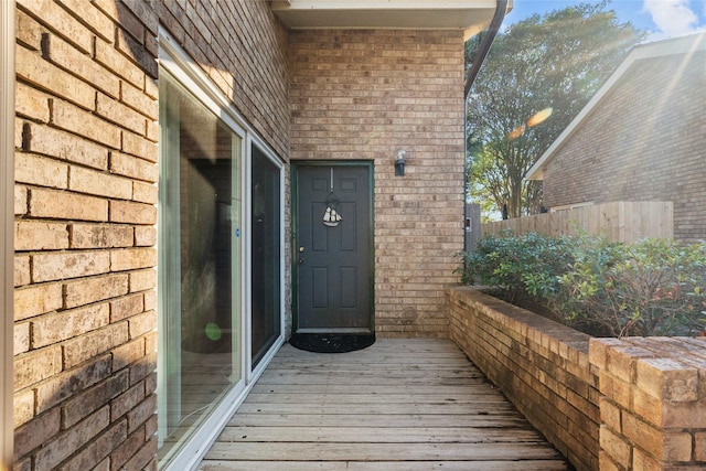 property entrance with a wooden deck