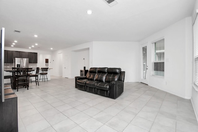 living room with light tile patterned floors