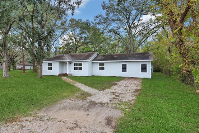 single story home with a front yard