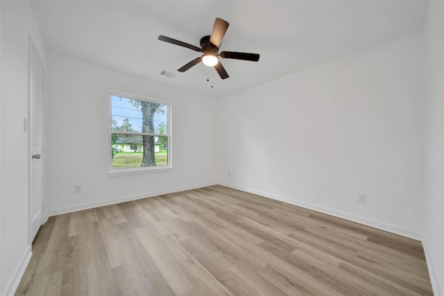 unfurnished room with ceiling fan and light wood-type flooring