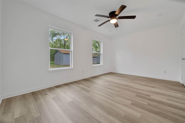 spare room featuring ceiling fan and light hardwood / wood-style floors