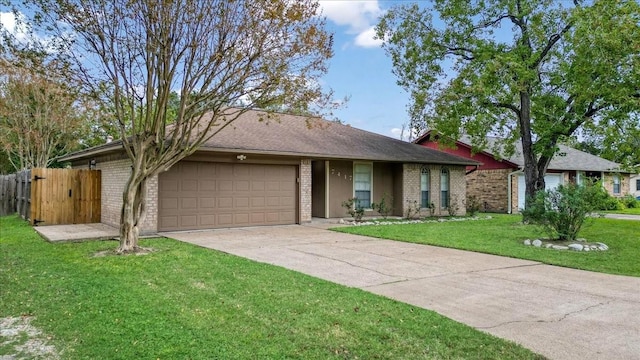 ranch-style home featuring a garage and a front yard