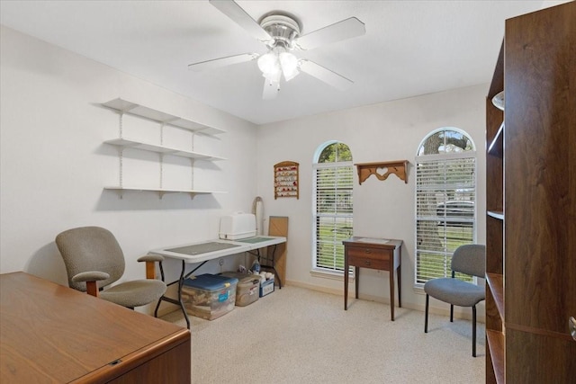 office with light colored carpet and ceiling fan