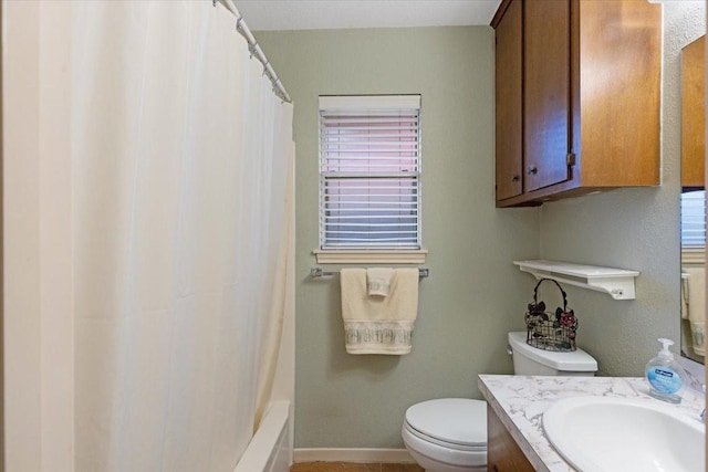 full bathroom with shower / bath combination with curtain, vanity, and toilet