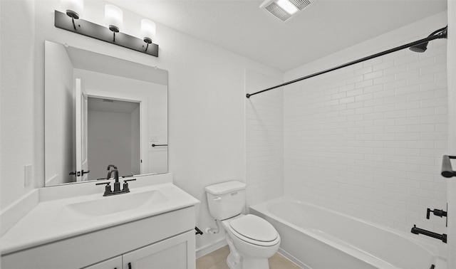 full bathroom with vanity, tiled shower / bath, and toilet