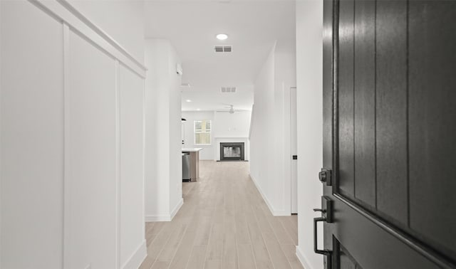 corridor featuring light hardwood / wood-style flooring