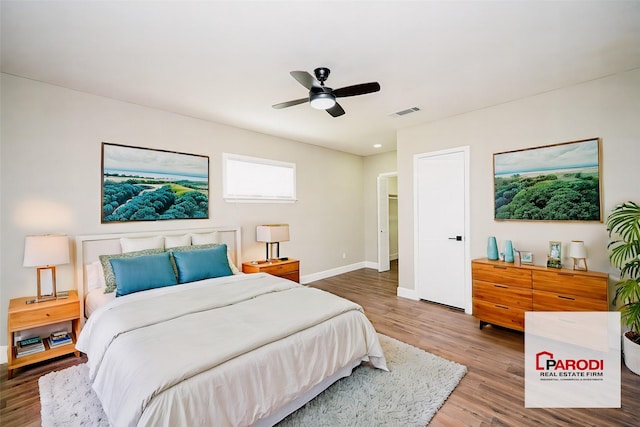 bedroom featuring ceiling fan and wood-type flooring