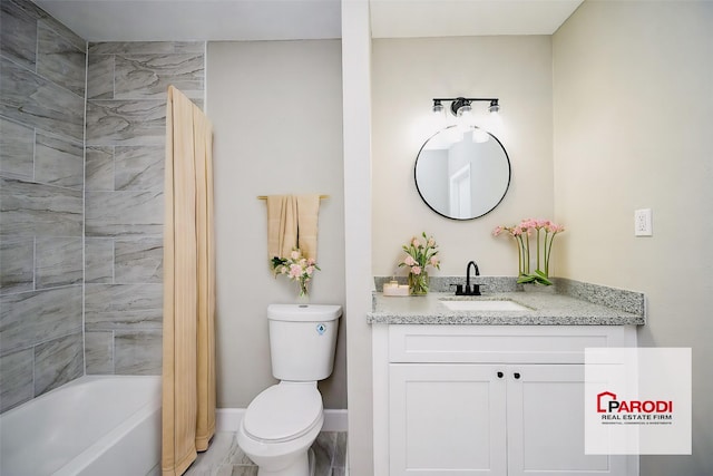 full bathroom with vanity, tiled shower / bath combo, and toilet