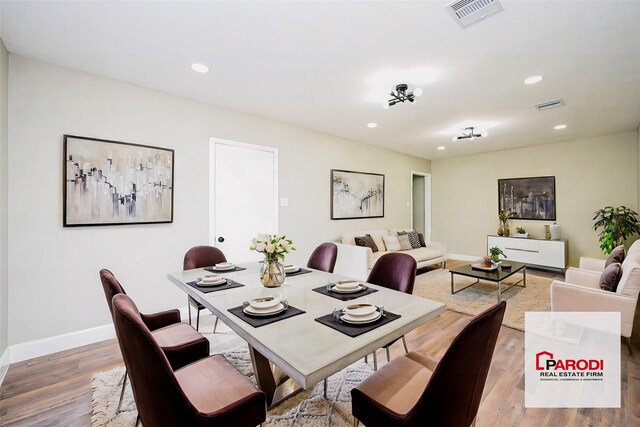 dining area with wood-type flooring