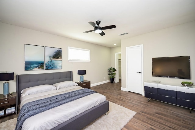 bedroom featuring dark hardwood / wood-style floors and ceiling fan