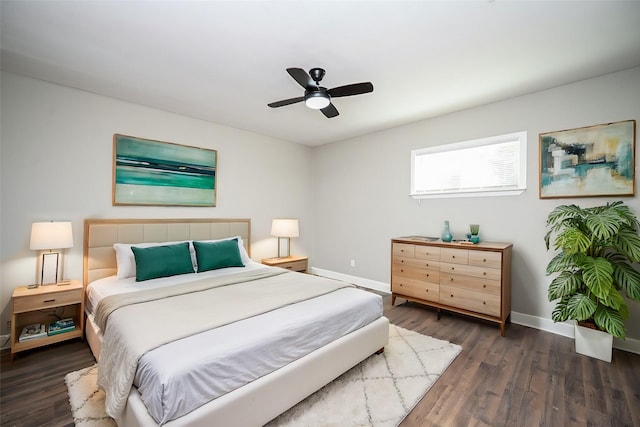 bedroom with dark wood-type flooring and ceiling fan