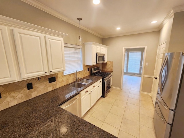 kitchen with crown molding, sink, appliances with stainless steel finishes, decorative light fixtures, and white cabinetry