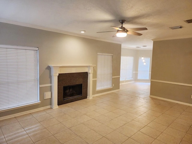 unfurnished living room featuring ceiling fan, light tile patterned flooring, and ornamental molding