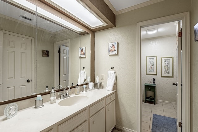 bathroom with tile patterned flooring and vanity