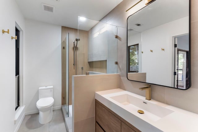 bathroom with vanity, toilet, and walk in shower