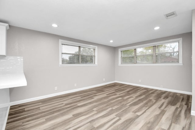 spare room with light hardwood / wood-style flooring