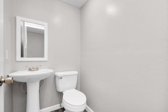 bathroom with sink and toilet