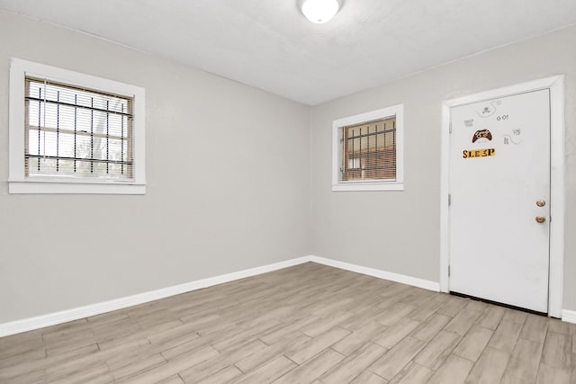 foyer entrance with light wood-type flooring